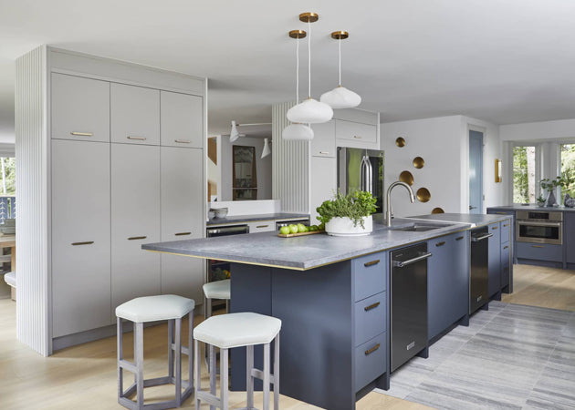 A grey and white Chef's Kitchen with blue island