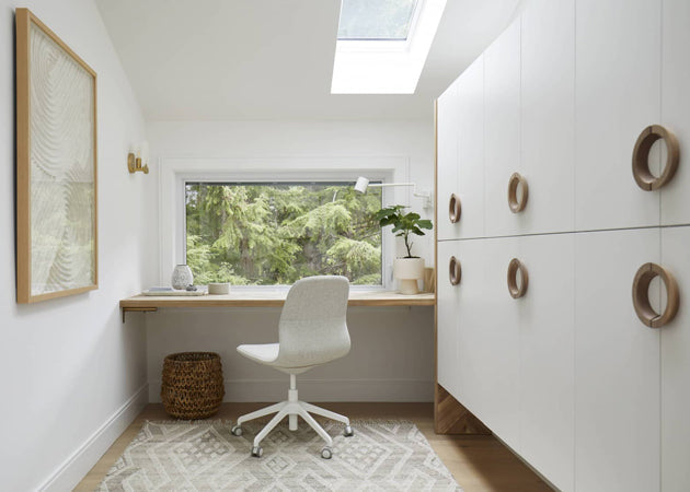 Home office with floating desk in front of window