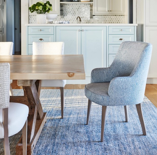 A blue chair at a dining table