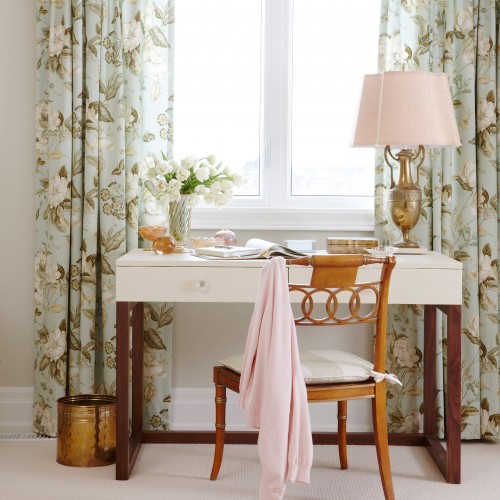 Floral drapes with vintage desk and wooden vintage chair